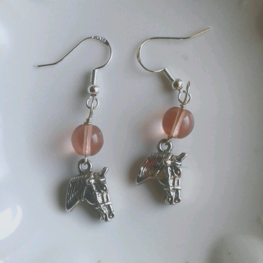 Earrings with pink stone and horses head